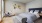 a bedroom with a bed and a chair