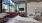 a living room with a large window and a tv