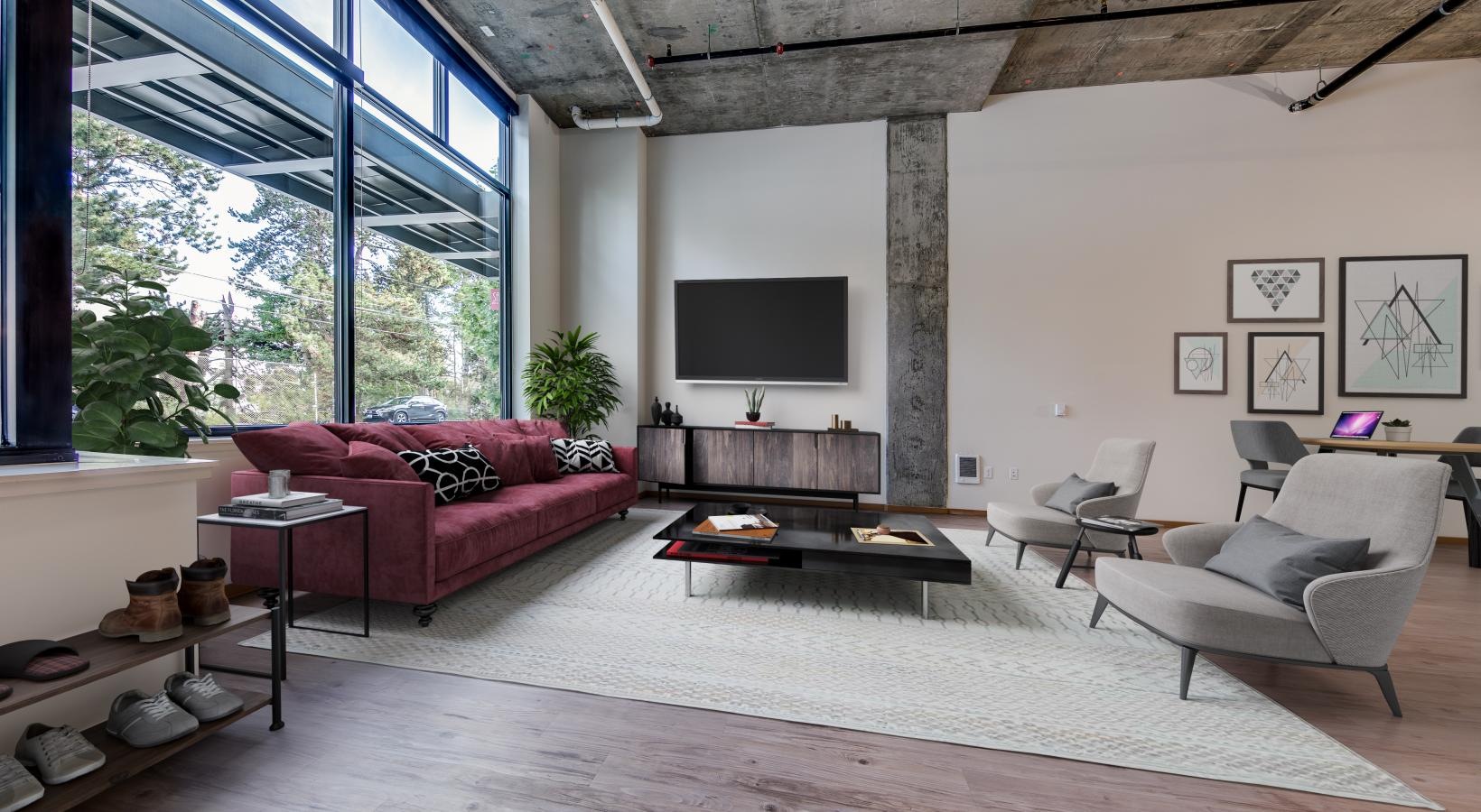 Generous living spaces with beautiful natural lighting a living room with a large window and a tv