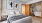 a bedroom with a bed and a closet