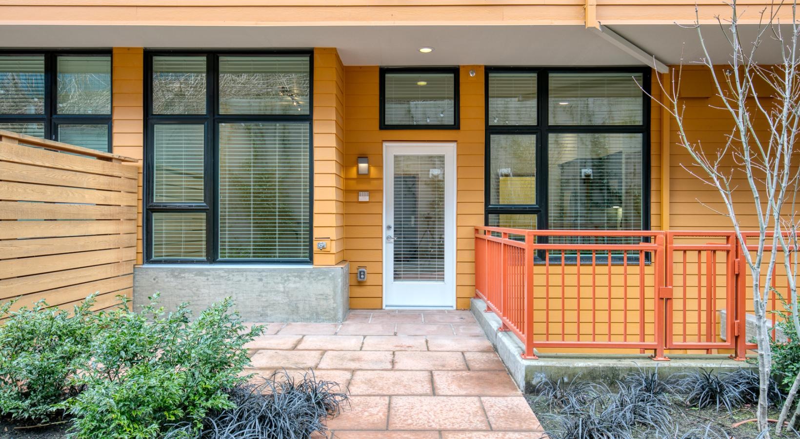 Settle into comfort at Forge West Seattle a building with a red railing